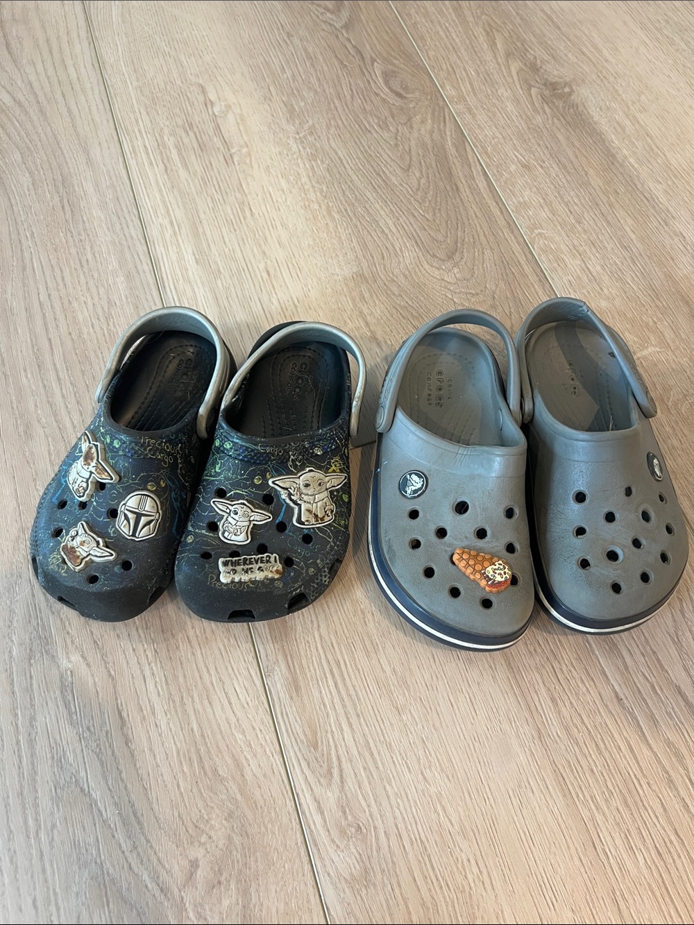 CROCS Kids Clogs Pair in Black and Gray with Character Jibbitz